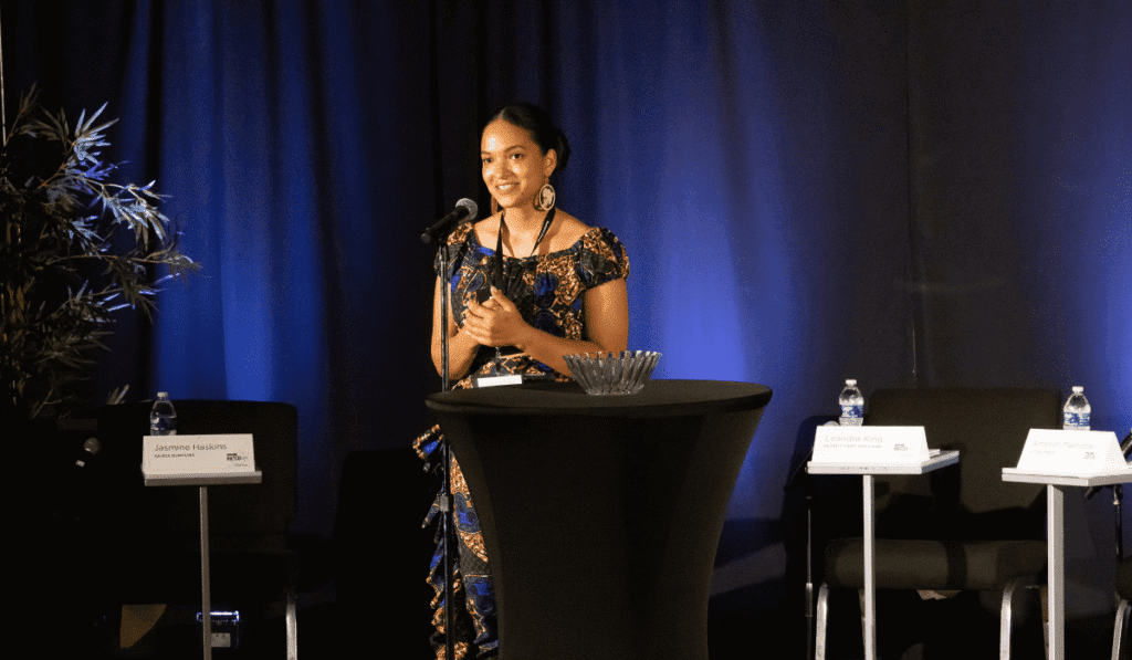 Ameneh Marhaba on stage presenting her business pitch at the Hatch Off