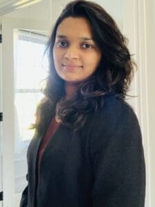 A woman wearing a blazer posing for a headshot
