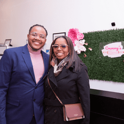 Mark and Charlita Knox in front of Crummy's sign